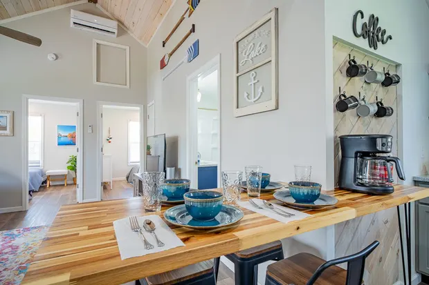 Butcher-block breakfast bar with stools and blue place settings.