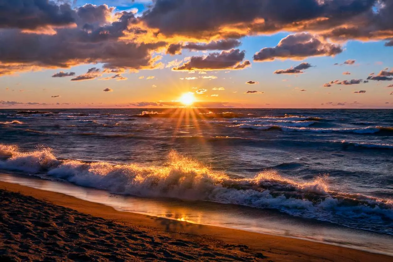 A scenic Lake Erie sunset view from the beach.