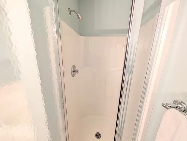 Full bathroom with a glass walk-in shower.