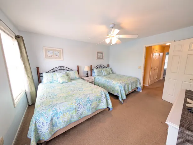 The queen-and-full bedroom from another angle, with the ensuite door.