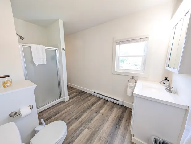 Upstairs bathroom with a glass walk-in shower.